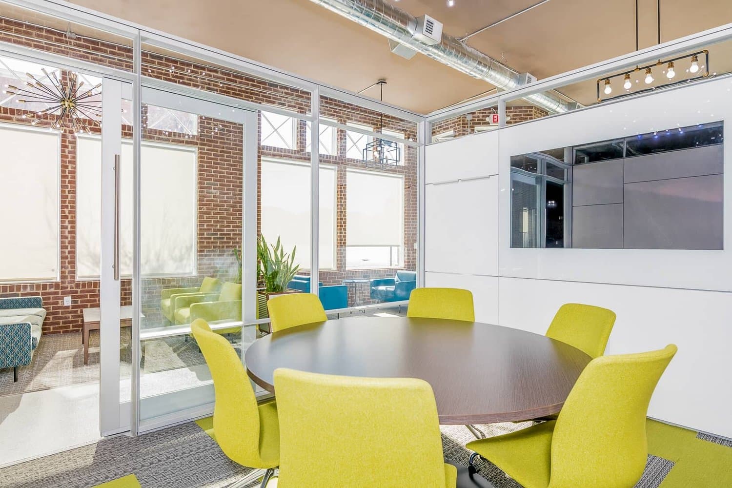 Small meeting room with monitor and round table