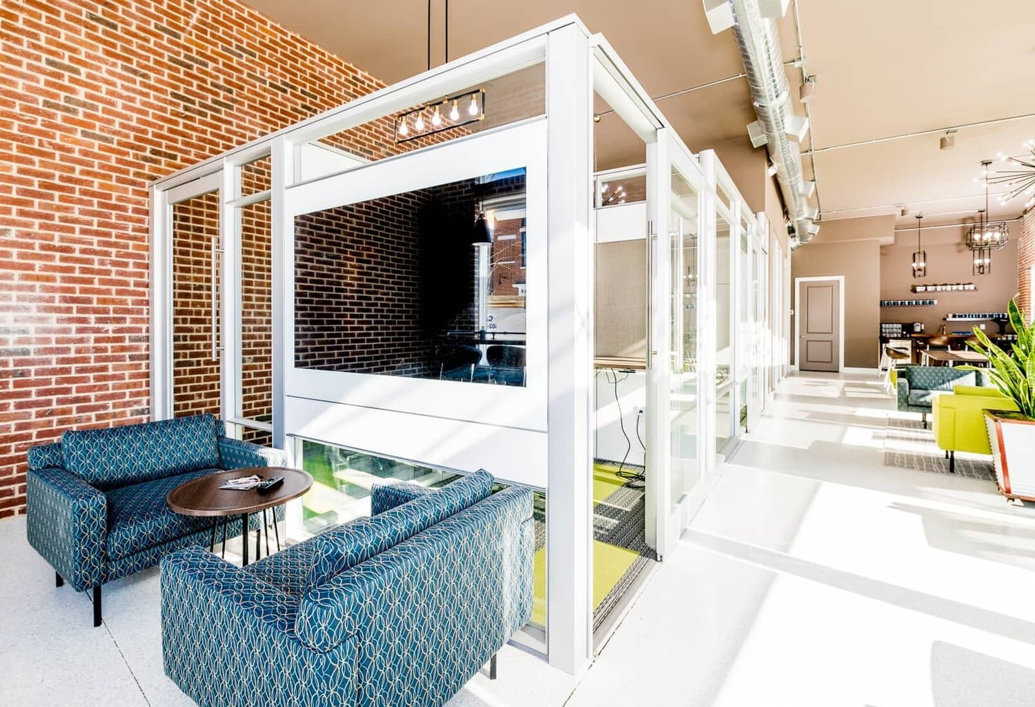 Glass meeting pod with lounge seating